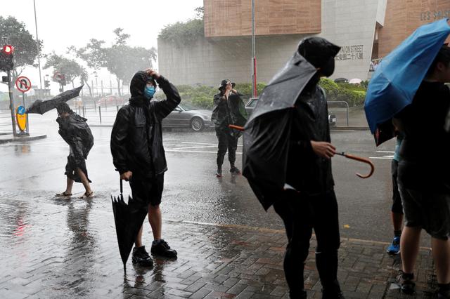 Protesters gather outside the Eastern Courts to support the arrested anti-extradition bill protesters who face rioting charges, as the typhoon Wipha approaches in Hong Kong, China July 31, 2019. REUTERS/Tyrone Siu
