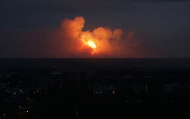 A view shows flame and smoke rising from the site of blasts at an ammunition depot near the town of Achinsk in Krasnoyarsk region, Russia August 5, 2019. REUTERS/Dmitry Dub 