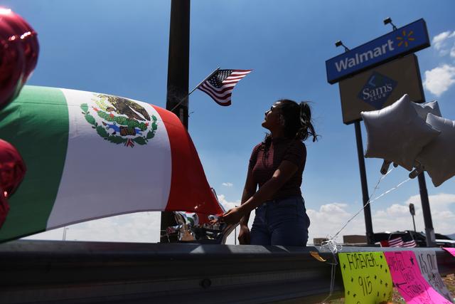 People gather to pay their respects at a growing memorial site two days after a mass shooting at a Walmart store in El Paso, Texas, U.S. August 5, 2019.  REUTERS/Callaghan O'Hare