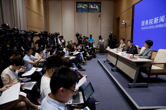 Yang Guang (C) and Xu Luying (R) of the Hong Kong and Macau Affairs Office of the State Council attends a news conference on the current situation in Hong Kong, in Beijing, China, August 6, 2019. REUTERS/Jason Lee