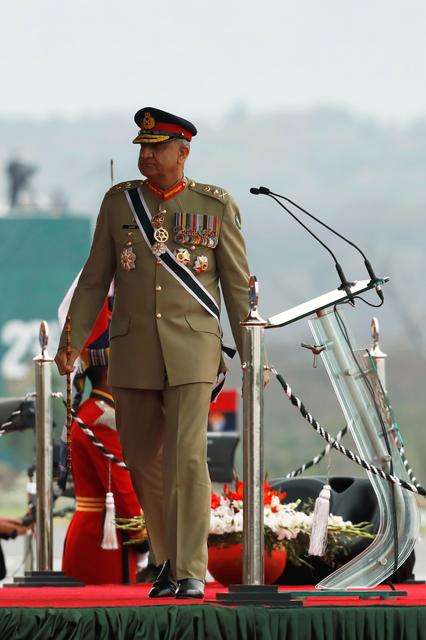 FILE PHOTO: Pakistan's Army Chief of Staff General Qamar Javed Bajwa, walks as he arrives to attend the Pakistan Day military parade in Islamabad, Pakistan March 23, 2019. REUTERS/Akhtar Soomro/File Photo