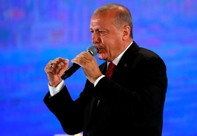 FILE PHOTO: Turkish President Tayyip Erdogan addresses supporters during a ceremony at Ataturk Airport in Istanbul, Turkey, July 15, 2019. REUTERS/Murad Sezer/File Photo