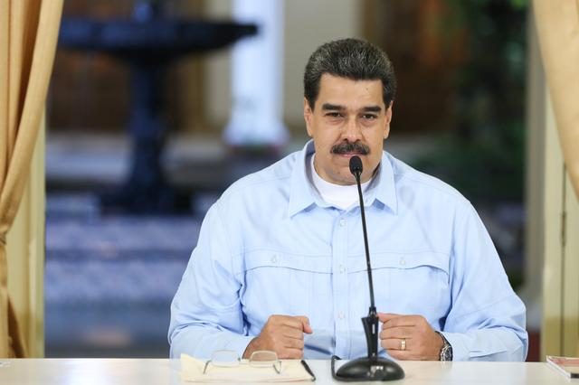 Venezuela's President Nicolas Maduro takes part in a meeting with members of the government at Miraflores Palace in Caracas, Venezuela July 25, 2019. Miraflores Palace/Handout via REUTERS 