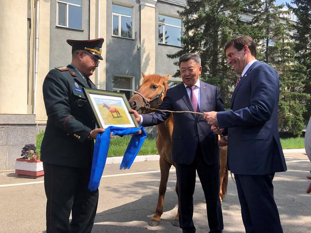 U.S. Secretary of Defense Mark Esper is gifted a horse in Ulan Bator, Mongolia August 8, 2019. REUTERS/Idrees Ali