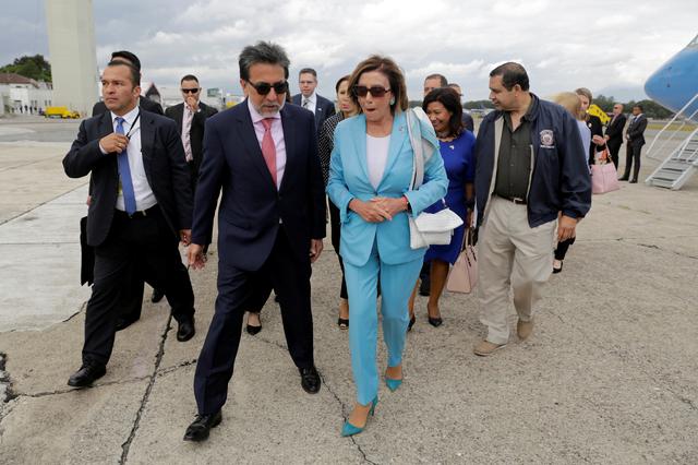 U.S. House Speaker Nancy Pelosi listens to U.S. Ambassador to Guatemala Luis Arreaga upon her arrival at the Guatemalan Air Force base in Guatemala City, Guatemala August 8, 2019. REUTERS/Stringer