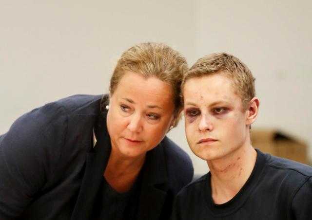 Philip Manshaus, who is suspected of an armed attack at Al-Noor Islamic Centre Mosque and killing his stepsister and his lawyer Unni Fries appear in court in Oslo, Norway, August 12, 2019. NTB Scanpix/Cornelius Poppe via REUTERS