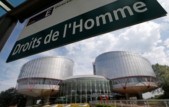 FILE PHOTO: A board at a tram stop reads Human rights in front of the European Court of Human Rights in Strasbourg, July 26, 2013. REUTERS/Vincent Kessler/File Photo