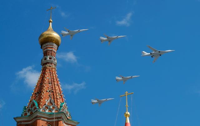 FILE PHOTO: Russian army Tupolev Tu-160 (R) and Tupolev Tu-22M3 fly in formation over St. Basil's Cathedral during the rehearsal for the Victory Day parade in Moscow, Russia May 4, 2019.  REUTERS/Tatyana Makeyeva/File Photo