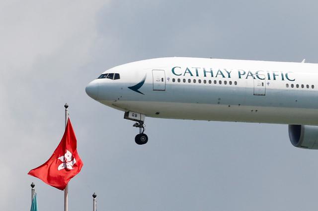 FILE PHOTO: A Cathay Pacific Boeing 777-300ER plane lands at Hong Kong airport after it reopened following clashes between police and protesters, in Hong Kong, China August 14, 2019. REUTERS/Thomas Peter/File Photo