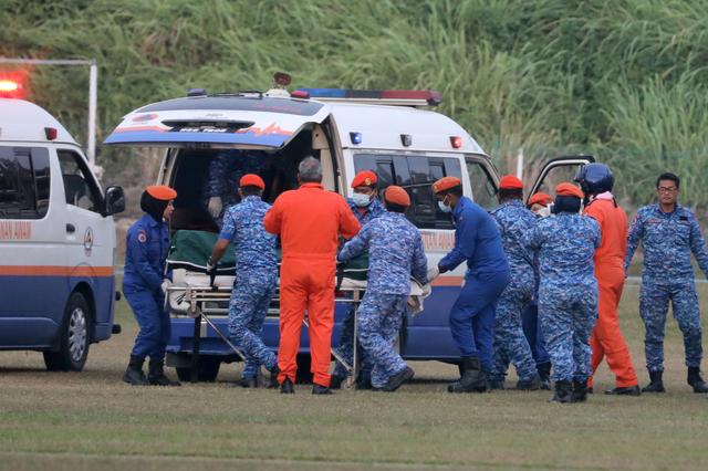 FILE PHOTO: A body believed to be 15-year-old Irish girl Nora Anne Quoirin who went missing is brought into a ambulance in Seremban, Malaysia, August 13, 2019. REUTERS/Lim Huey Teng