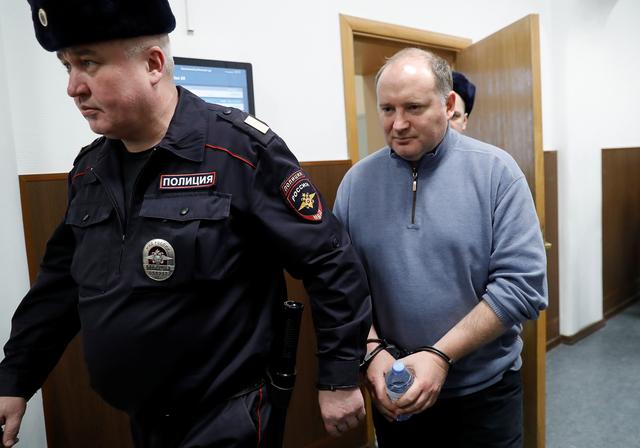 Partner in the Baring Vostok private equity group Philippe Delpal, who was detained on suspicion of fraud, is escorted inside a court building in Moscow, Russia February 15, 2019. REUTERS/Tatyana Makeyeva