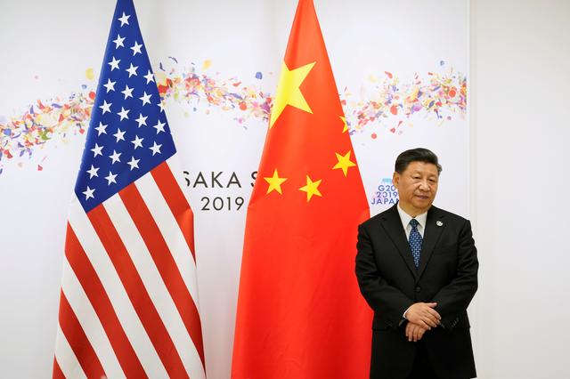 FILE PHOTO: China's President Xi Jinping waits ahead of their bilateral meeting with U.S. President Donald Trump  during the G20 leaders summit in Osaka, Japan, June 29, 2019. REUTERS/Kevin Lamarque/File Photo