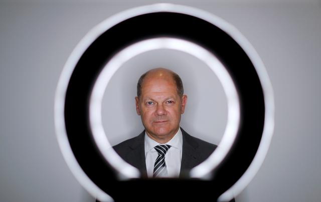FILE PHOTO: German Finance Minister Olaf Scholz poses for a portrait during an interview with Reuters in his ministry in Berlin, Germany, June 5, 2019.     REUTERS/Fabrizio Bensch/File Photo