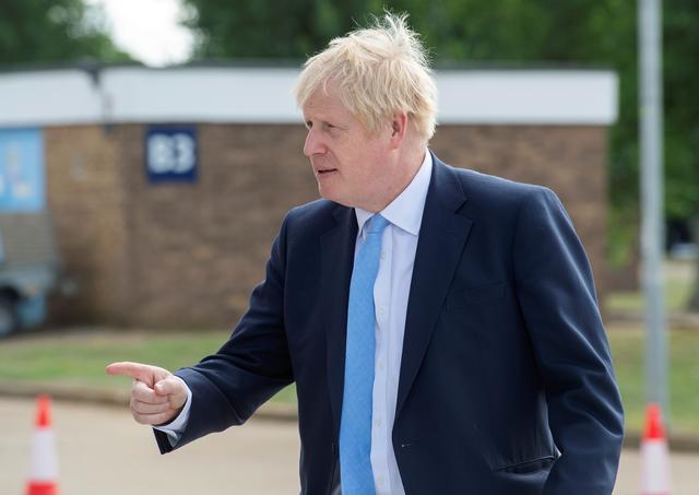 FILE PHOTO: Britain's Prime Minister Boris Johnson visits the Fusion Energy Research Centre at the Fulham Science Centre in Oxfordshire, Britain August 8, 2019. Julian Simmonds/File Photo