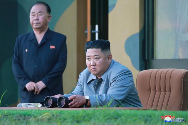 FILE PHOTO: North Korean leader Kim Jong Un watches the test-fire of two short-range ballistic missiles on Thursday, in this undated picture released by North Korea's Central News Agency (KCNA) on July 26, 2019.  KCNA/via REUTERS 