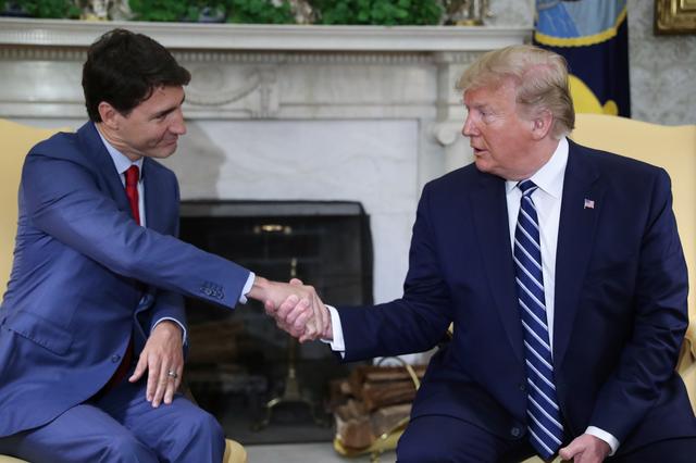FILE PHOTO: U.S. President Donald Trump meets with Canada's Prime Minister Justin Trudeau in the Oval Office of the White House in Washington, U.S., June 20, 2019. REUTERS/Jonathan Ernst