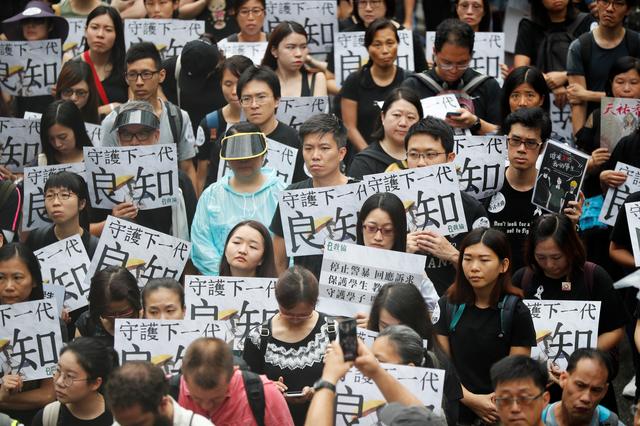 Teachers protest against the extradition bill during a rally organised by Hong Kong Professional Teachers' Union in Hong Kong, China August 17, 2019. REUTERS/Kim Hong-Ji