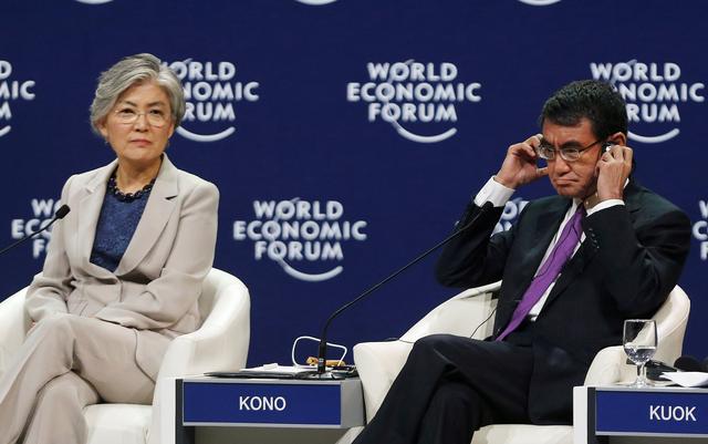 FILE PHOTO - South Korea's Foreign Minister Kang Kyung-Wha (L) and Japan's Foreign Minister Taro Kono attend the Asia's Geopolitical Outlook during the World Economic Forum on ASEAN at the National Convention Center in Hanoi, Vietnam September 13, 2018. REUTERS/Kham