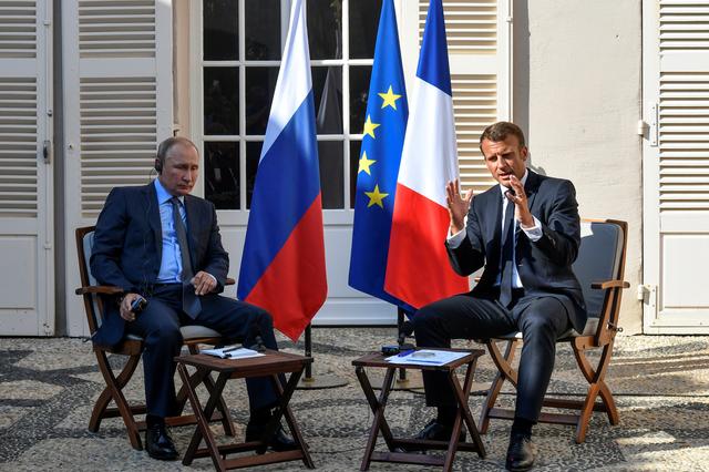 French President Emmanuel Macron meets with Russia's President Vladimir Putin, at his summer retreat of the Bregancon fortress on the Mediterranean coast, near the village of Bormes-les-Mimosas, southern France, on August 19, 2019. Gerard Julien/Pool via REUTERS