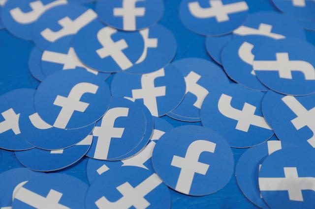 FILE PHOTO: Stickers bearing the Facebook logo are pictured at Facebook Inc's F8 developers conference in San Jose, California, U.S., April 30, 2019.  REUTERS/Stephen Lam