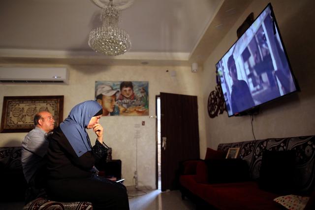Hussein and Suha Abu Khdeir, whose son's murder is the subject of the HBO series Our Boys, watch the show's first two episodes in their East Jerusalem home August 18, 2019. REUTERS/Ammar Awad