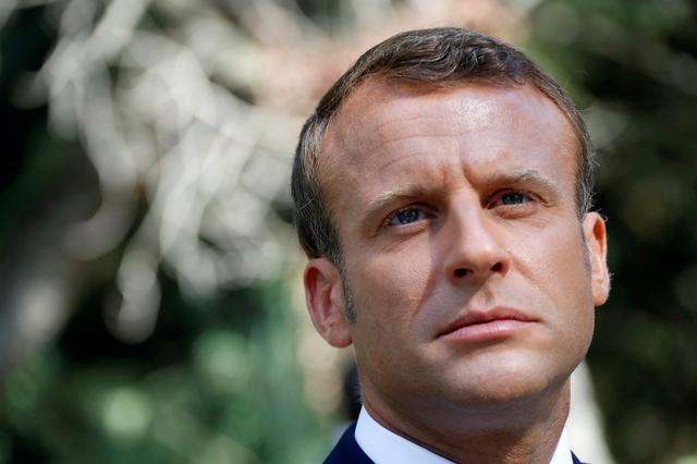 FILE PHOTO: French President Emmanuel Macron reacts as he arrives at a ceremony marking the 75th anniversary of the Allied landings in Provence in World War Two which helped liberate southern France, in Boulouris, France, August 15, 2019.  REUTERS/Eric Gaillard/File Photo