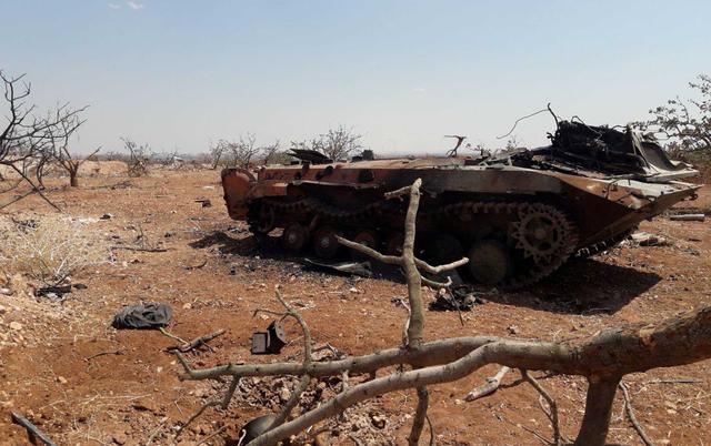 A damaged military tank is seen in Idlib countryside, Syria in this handout released by SANA on August 22, 2019. SANA/Handout via REUTERS 