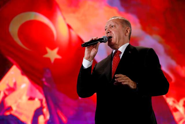 FILE PHOTO: Turkish President Tayyip Erdogan addresses his supporters during a ceremony marking the third anniversary of the attempted coup at Ataturk Airport in Istanbul, Turkey, July 15, 2019. REUTERS/Murad Sezer/File Photo