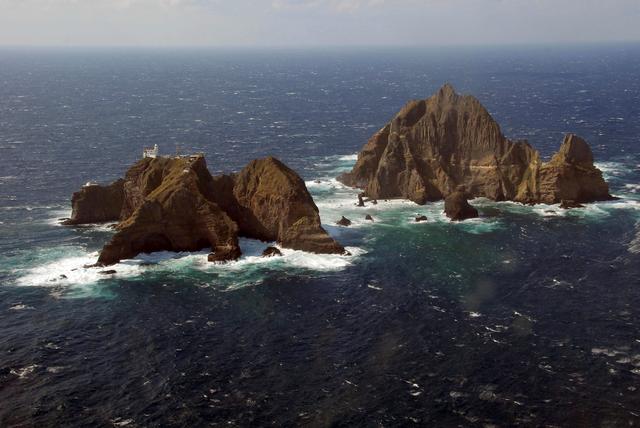 FILE PHOTO: An aerial view shows a part of the group of islets known in South Korea as Dokdo and in Japan as Takeshima in the Sea of Japan, October 20, 2007.  REUTERS/Yuri Maltsev/File Photo