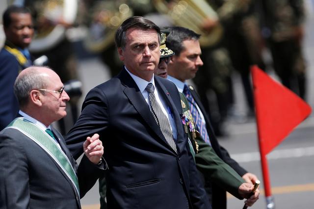 FILE PHOTO: Brazil's President Jair Bolsonaro looks on during a Soldier's Day ceremony, in Brasilia, Brazil August 23, 2019. REUTERS/Adriano Machado