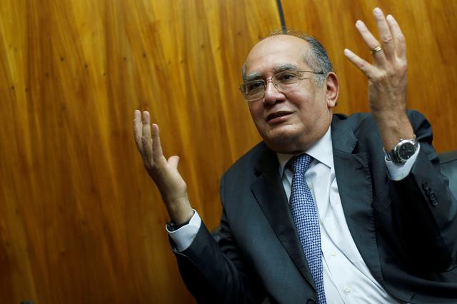 FILE PHOTO: Judge Gilmar Mendes gestures during an interview with Reuters in Brasilia, Brazil August 22, 2019. . REUTERS/Adriano Machado/File Photo
