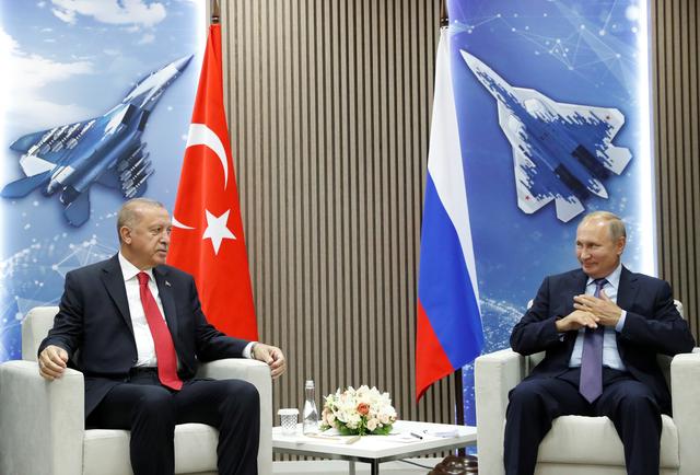 Russian President Vladimir Putin and Turkish President Recep Tayyip Erdogan speak during their meeting on the sidelines of the MAKS-2019 International Aviation and Space Salon in Zhukovsky outside Moscow, Russia, August  27, 2019. Maxim Shipenkov/Pool via REUTERS