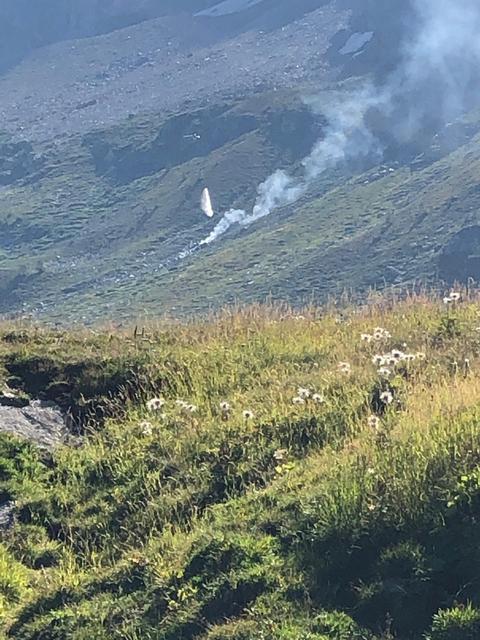 Smoke is seen at the site of a plane crash at the Simplon Pass in Switzerland, in this picture released by Police Cantonale du Valais on August 25, 2019. Police Cantonale du Valais/Handout via REUTERS