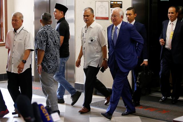 Former Malaysian Prime Minister Najib Razak walks to a courtroom after a break at Kuala Lumpur High Court in Kuala Lumpur, Malaysia, August 28, 2019. REUTERS/Lai Seng Sin