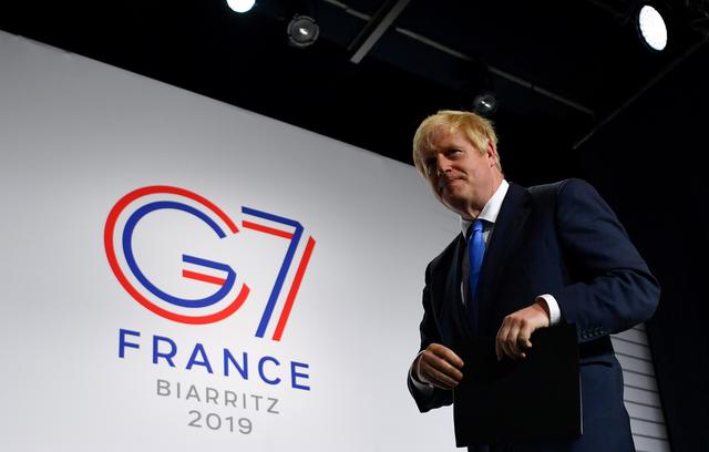 FILE PHOTO: Britain's Prime Minister Boris Johnson leaves a news conference at the end of the G7 summit in Biarritz, France, August 26, 2019. REUTERS/Dylan Martinez