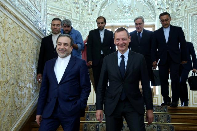 FILE PHOTO: Iran's deputy foreign minister, Abbas Araqchi (L), with visiting senior French diplomat Emmanuel Bonne in Tehran, Iran, July 10, 2019.  Nazanin Tabatabaee/WANA  (West Asia News Agency) via REUTERS. 
