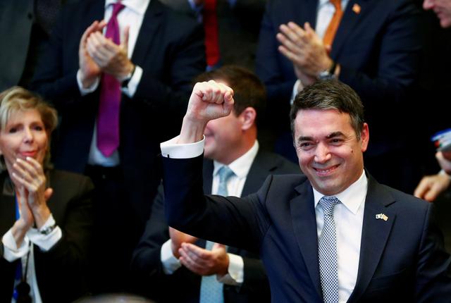 FILE PHOTO: Macedonian Foreign Minister Nikola Dimitrov raises his fist during a signature ceremony of the accession protocol between the Republic of North Macedonia and NATO at the Alliance headquarters in Brussels, Belgium February 6, 2019.  REUTERS/Francois Lenoir/File Photo