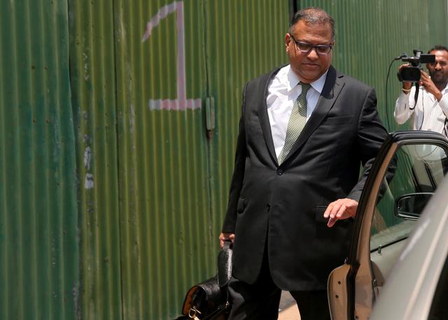 FILE PHOTO: Sri Lanka's former Central Bank Governor Arjuna Mahendran leaves the Presidential Commission of Inquiry to Investigate and Inquire into the Issuance of Treasury Bonds in Colombo, Sri Lanka March 10, 2017. REUTERS/Dinuka Liyanawatte