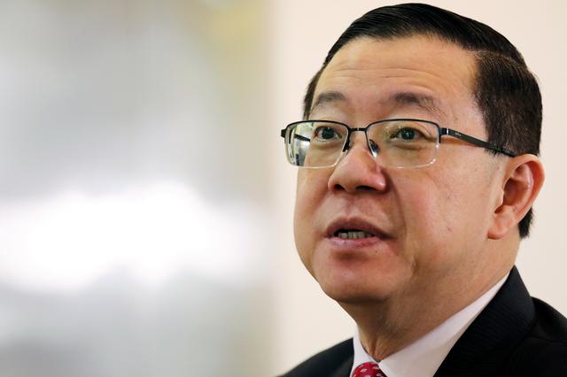 FILE PHOTO: Malaysia's Finance Minister Lim Guan Eng speaks during an interview with Reuters in Putrajaya, Malaysia, July 22, 2019. REUTERS/Lim Huey Teng