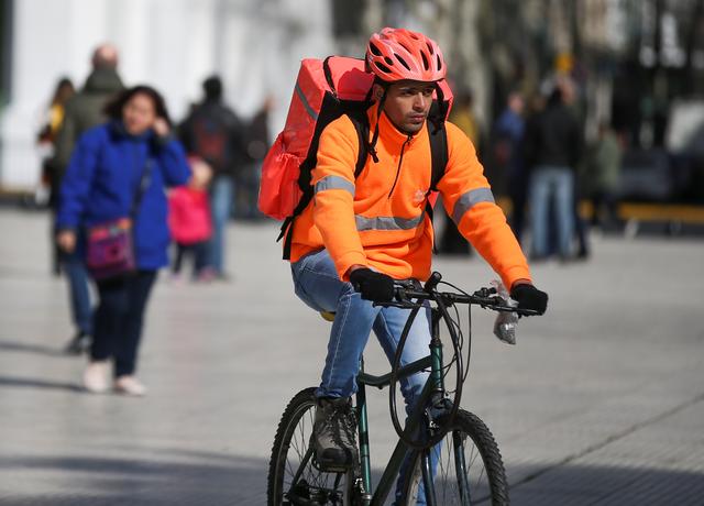 Juan Jose Granados Hernandez, a Venezuelan who lives in Buenos Aires, rides his bike in the capital city in Argentina September 4, 2019.  REUTERS/Agustin Marcarian