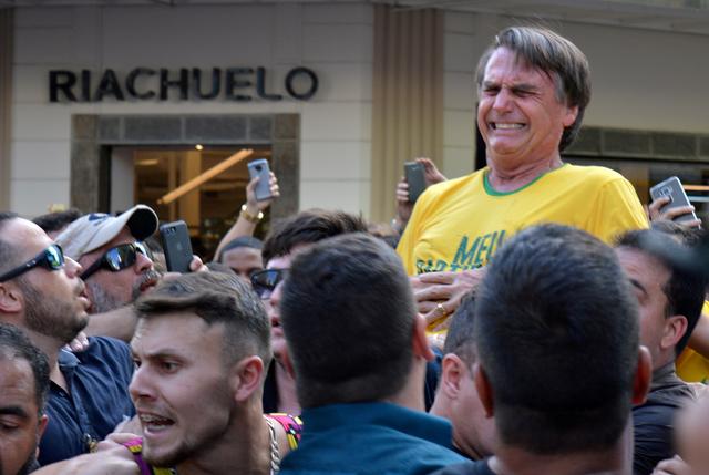 FILE PHOTO: Brazilian presidential candidate Jair Bolsonaro reacts after being stabbed during a rally in Juiz de Fora, Minas Gerais state, Brazil, September 6, 2018. REUTERS/Raysa Campos Leite/File Photo