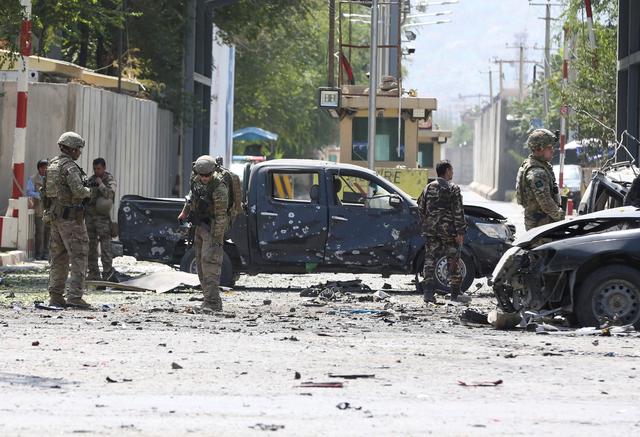 Foreign troops with NATO-led Resolute Support Mission investigate at the site of a suicide attack in Kabul, Afghanistan September 5, 2019. REUTERS/Omar Sobhani