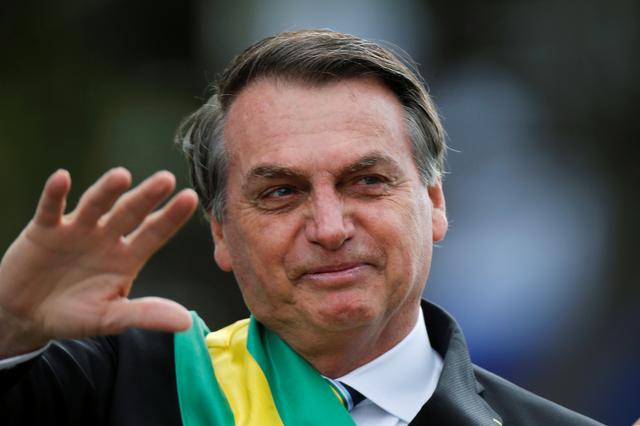 FILE PHOTO: Brazil's President Jair Bolsonaro gestures during a parade celebrating the country's Independence Day in Brasilia, Brazil, September 7, 2019. REUTERS/Adriano Machado/File Photo