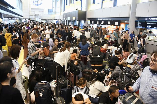 Passengers are stranded after railways and subway operators suspended their services due to Typhoon Faxai, at Narita airport in Narita, east of Tokyo, Japan September 9, 2019, in this photo taken by Kyodo. Mandatory credit Kyodo/via REUTERS 