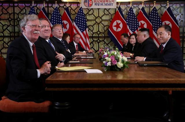 FILE PHOTO: North Korea's leader Kim Jong Un and U.S. President Donald Trump attend the extended bilateral meeting in the Metropole hotel with U.S. Secretary of State Mike Pompeo, White House national security adviser John Bolton, acting White House Chief of Staff Mick Mulvaney, North Korean Foreign Minister Ri Yong Ho and Kim Yong Chol, Vice Chairman of the North Korean Workers' Party Committee, during the second North Korea-U.S. summit in Hanoi, Vietnam February 28, 2019. REUTERS/Leah Millis/File Photo