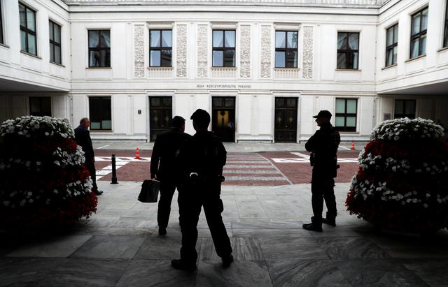 FILE PHOTO - Security guards of Parliament stands outside the building of Parliament in Warsaw July 18, 2018. REUTERS/Kacper Pempel