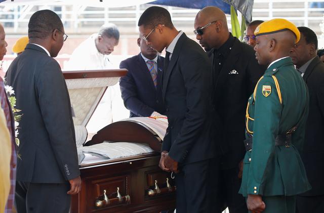 Robert Mugabe Jnr, pays his last respects to his father, Robert Mugabe as his body lies in state at the at Rufaro stadium, in Mbare, Harare, Zimbabwe, September 13, 2019. REUTERS/Siphiwe Sibeko