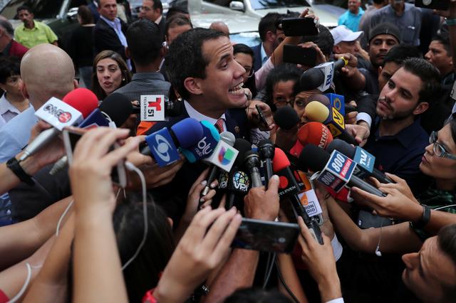 Venezuelan opposition leader Juan Guaido, who many nations have recognized as the country's rightful interim ruler, talks to the media while arriving  to attend a political rally in Caracas, Venezuela September 13, 2019. REUTERS/Ivan Alvarado