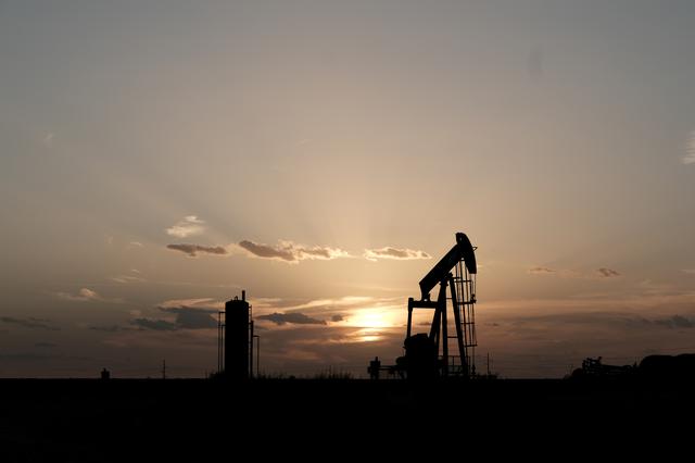 FILE PHOTO: Oil pump jacks work at sunset near Midland, Texas, U.S., August 21, 2019.   REUTERS/Jessica Lutz/File Photo