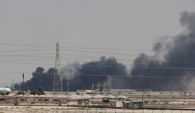 FILE PHOTO: Smoke is seen following a fire at Aramco facility in the eastern city of Abqaiq, Saudi Arabia, September 14, 2019. REUTERS/Stringer/File Photo/File Photo
